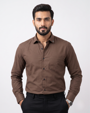 Brown cotton button-up shirt with long sleeves, collar, and chest pocket