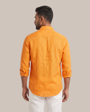 Orange linen shirt, back view with buttoned yoke and long sleeves
