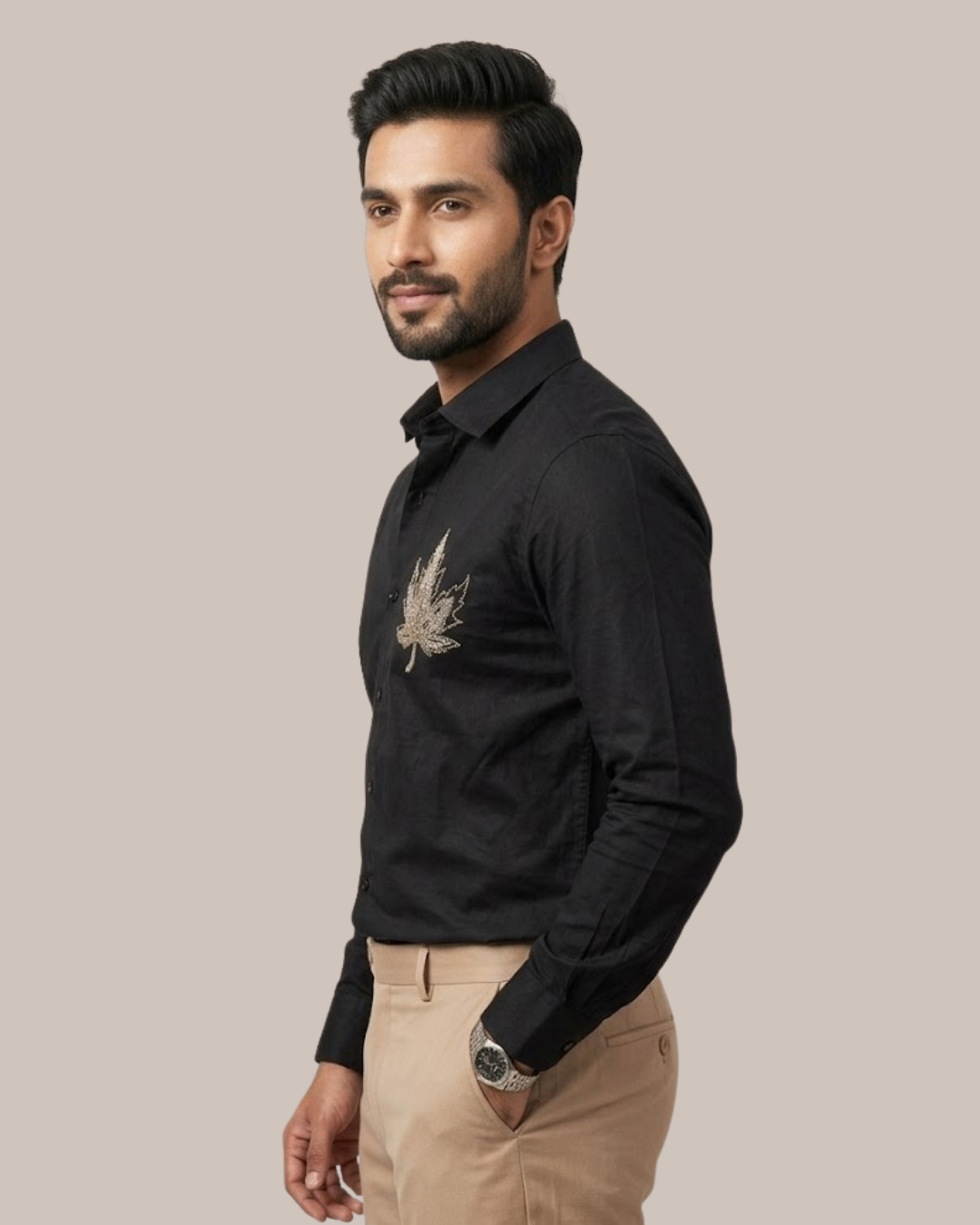 Black cotton satin lycra button-up shirt with gold leaf emblem on front.