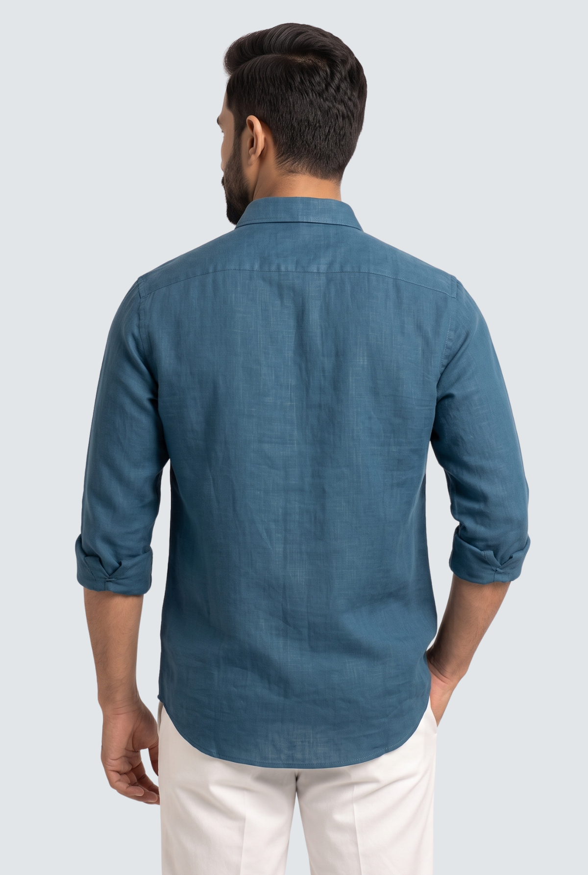 Men's Rama linen shirt in teal blue, back view, button placket and curved hem