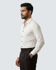 White button-up shirt side view with long sleeves and dark button placket