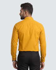 Yellow cotton button-up shirt, back view with long sleeves and buttoned placket