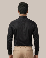 Black cotton satin lycra shirt, plain back with buttoned cuffs.