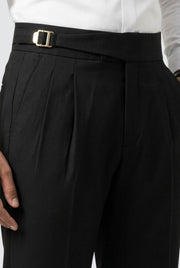 Men's black pleated trousers with belt buckle and front crease details