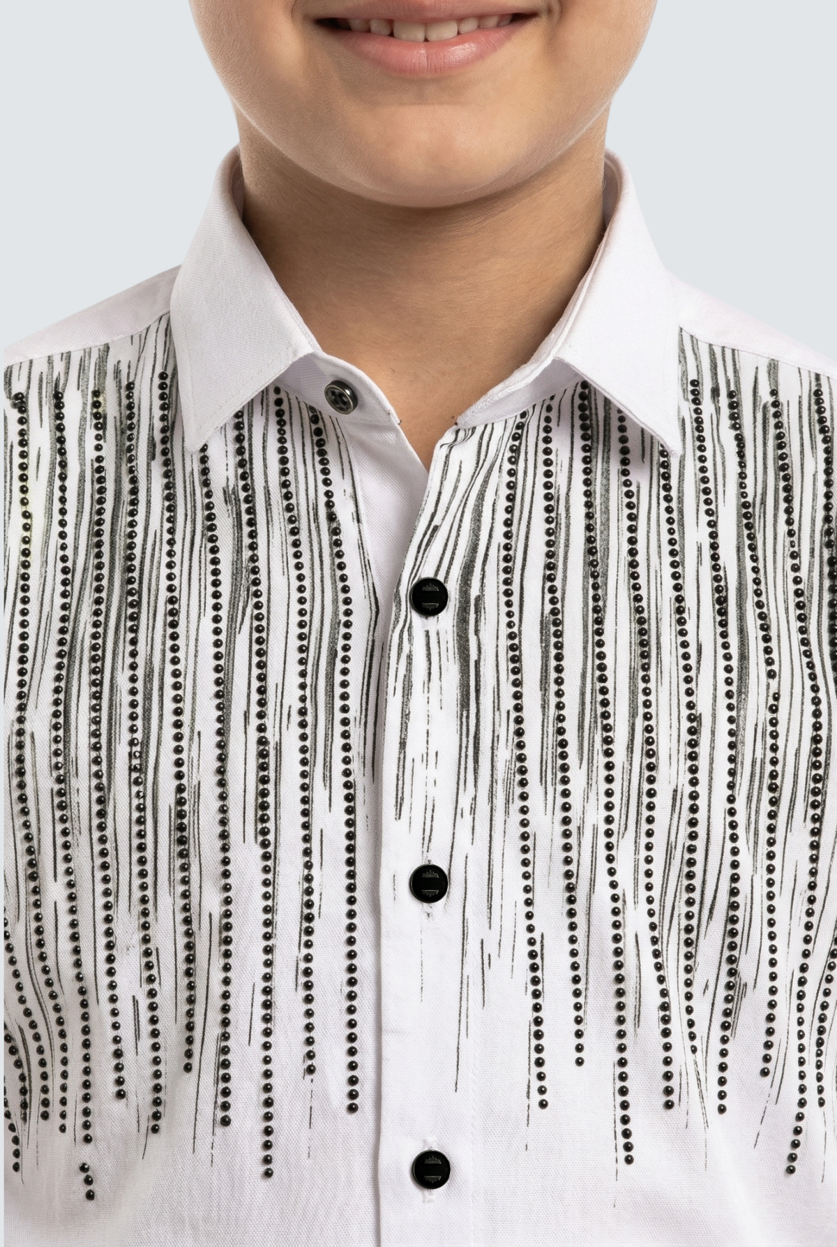 Kids white dress shirt close-up: black sequin vertical stripes and black button front
