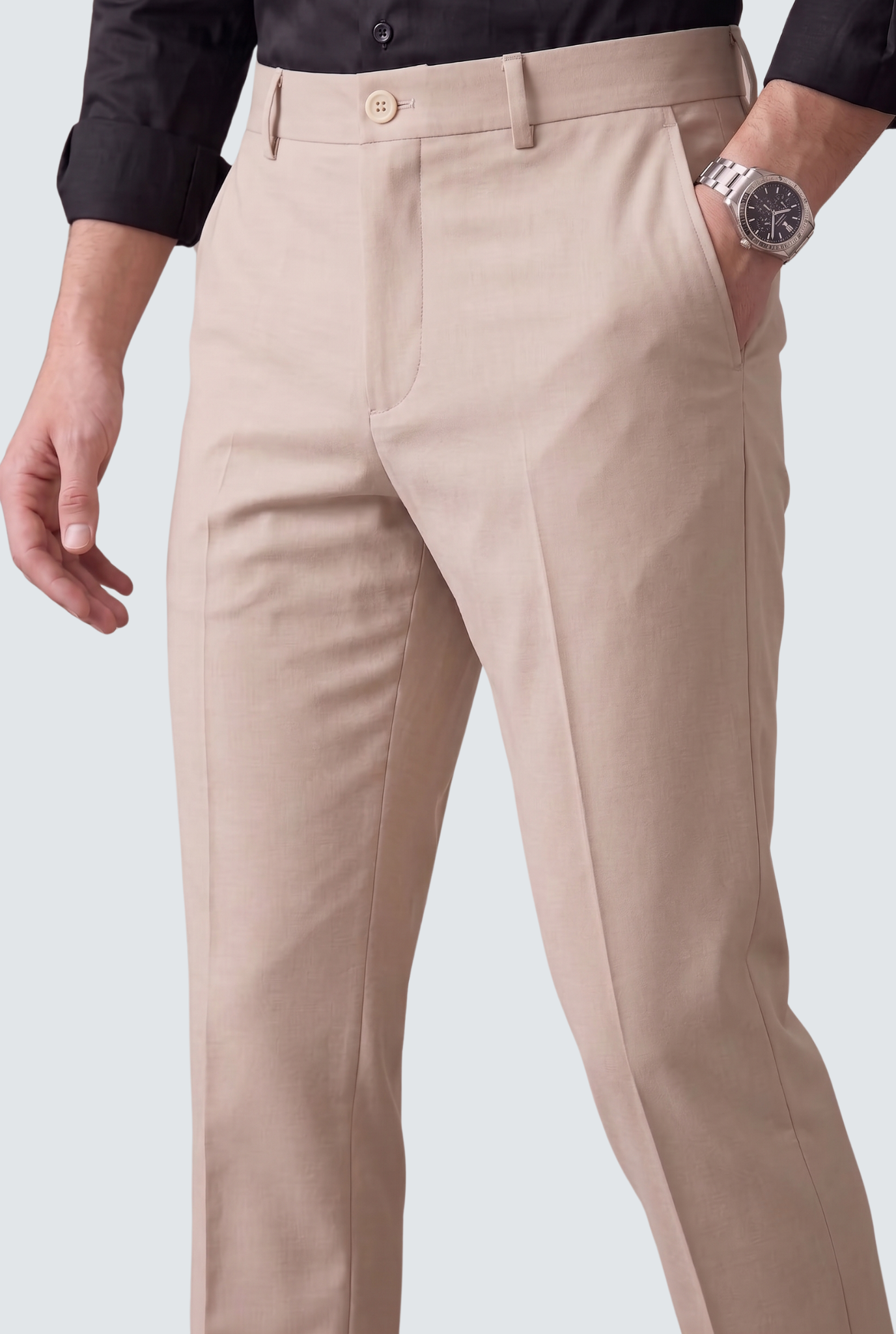 Men's fawn slim-fit regular trousers, close-up of waistband, button and belt loops