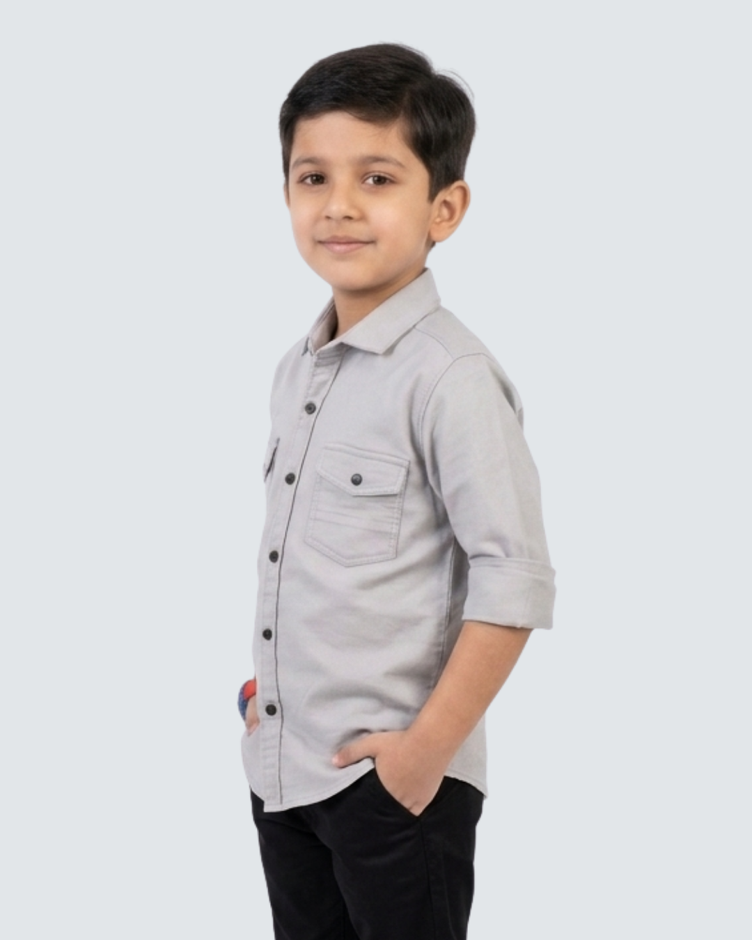 Boys' grey cotton button-up shirt with chest pockets, side profile