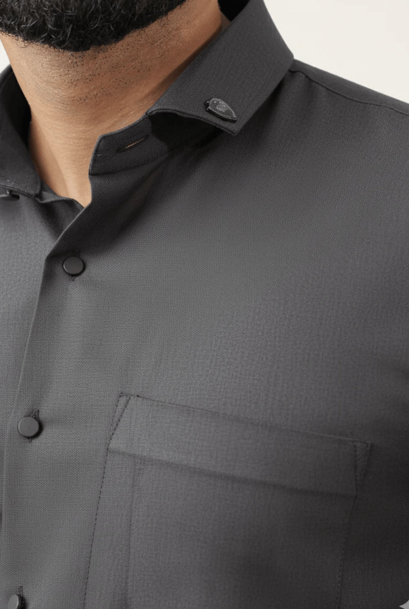 “Close-up fabric and button details dark grey cotton shirt men”