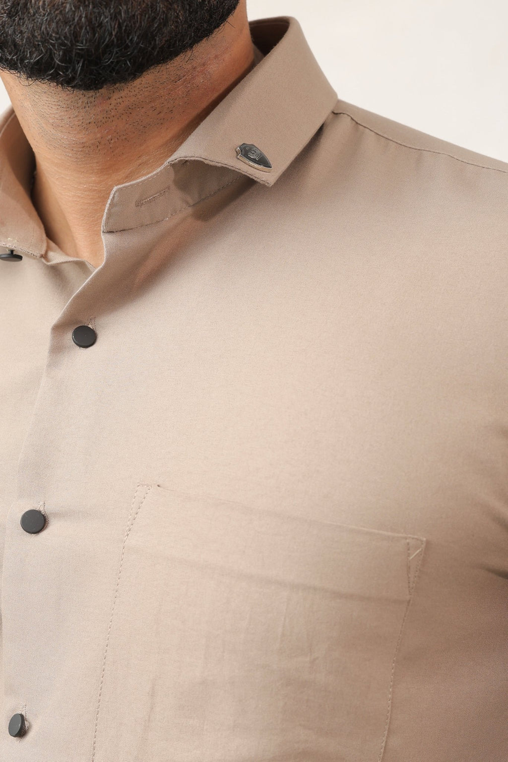 Close-up of beige shirt fabric – soft cotton texture