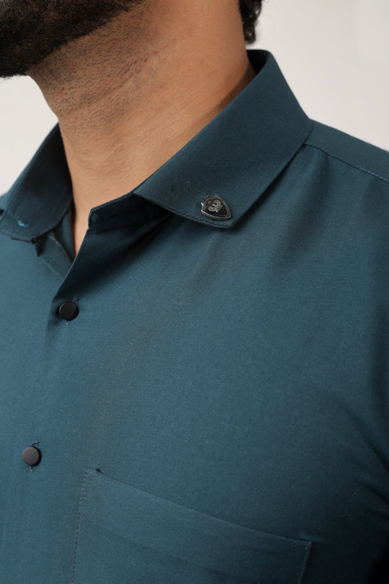 Close-up of teal green cotton texture – lightweight and cool