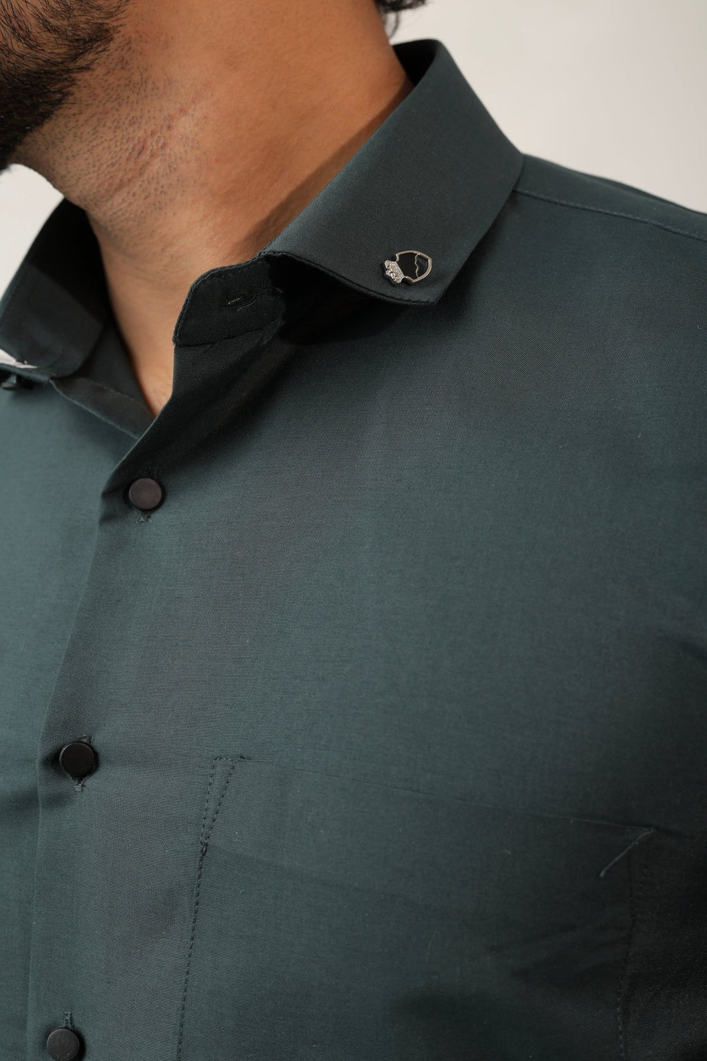 Close-up of dark green cotton fabric – soft & rich texture