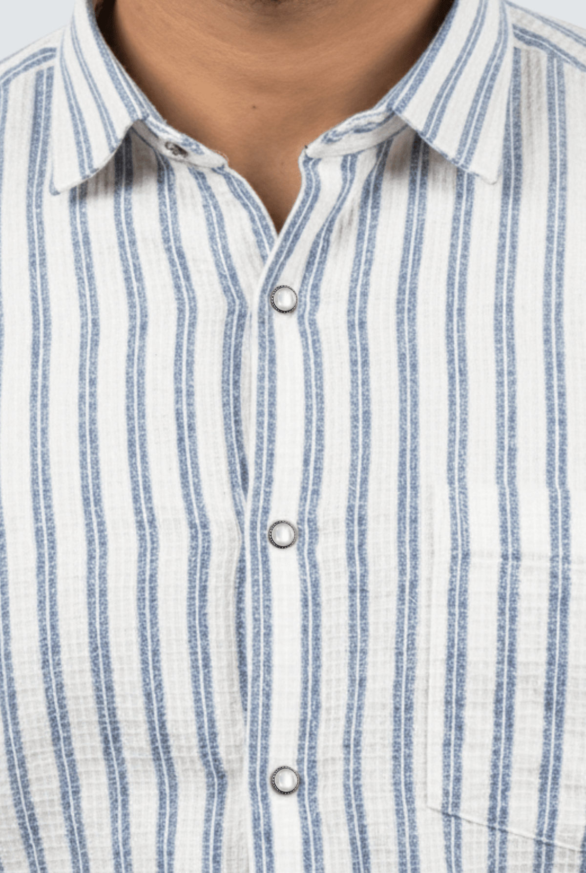 Men's striped cotton button-up shirt detail: point collar and white button placket