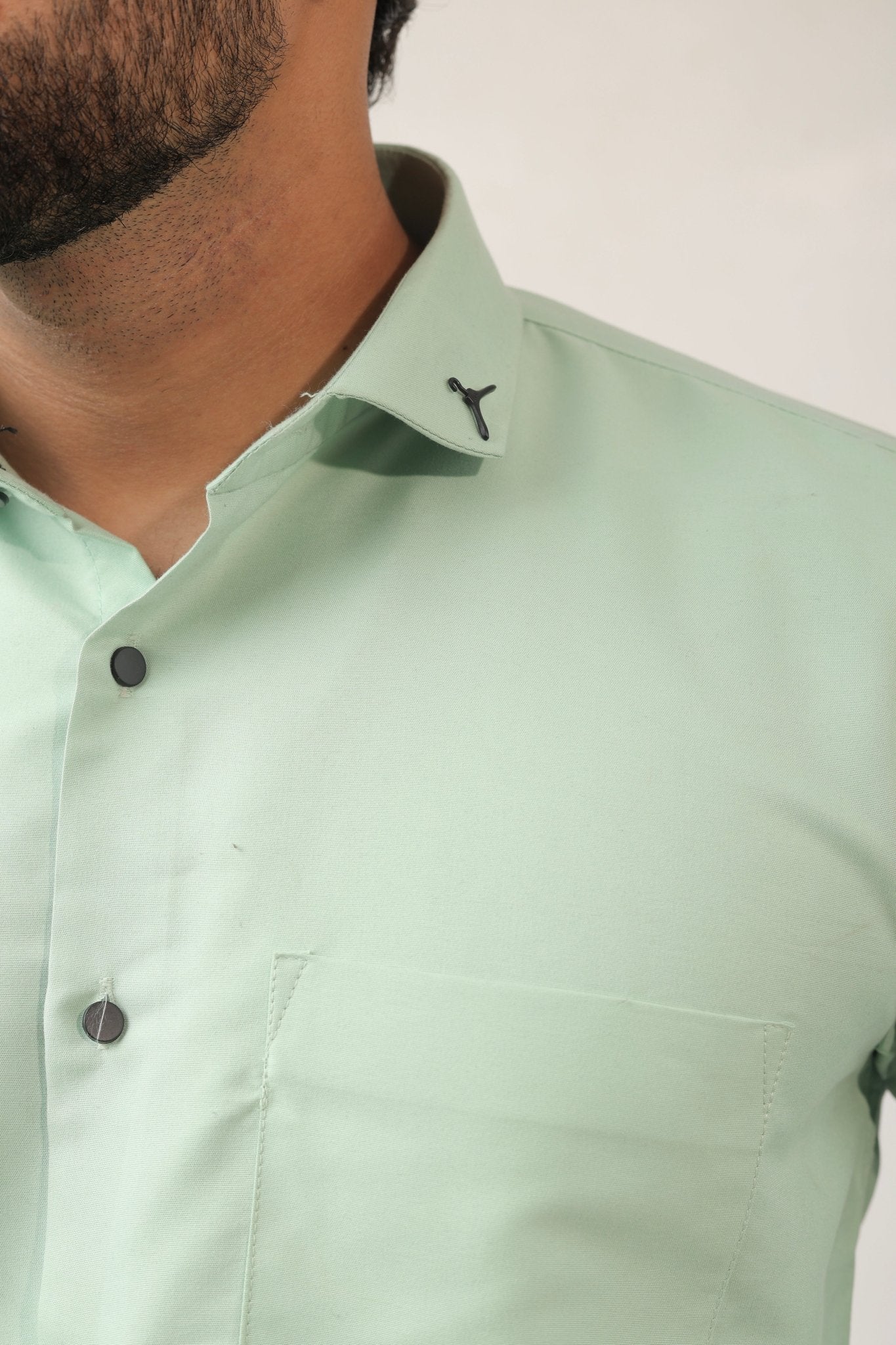 Close-up of mint green fabric – lightweight cotton texture