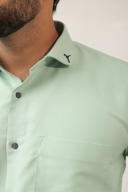 Close-up of mint green fabric – lightweight cotton texture