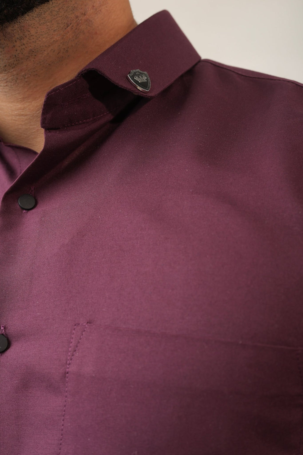 Close-up of soft breathable cotton fabric in purple shirt