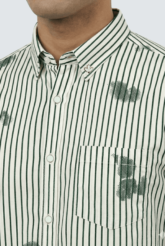 “Close-up of white and green striped printed shirt showing fabric and collar details”