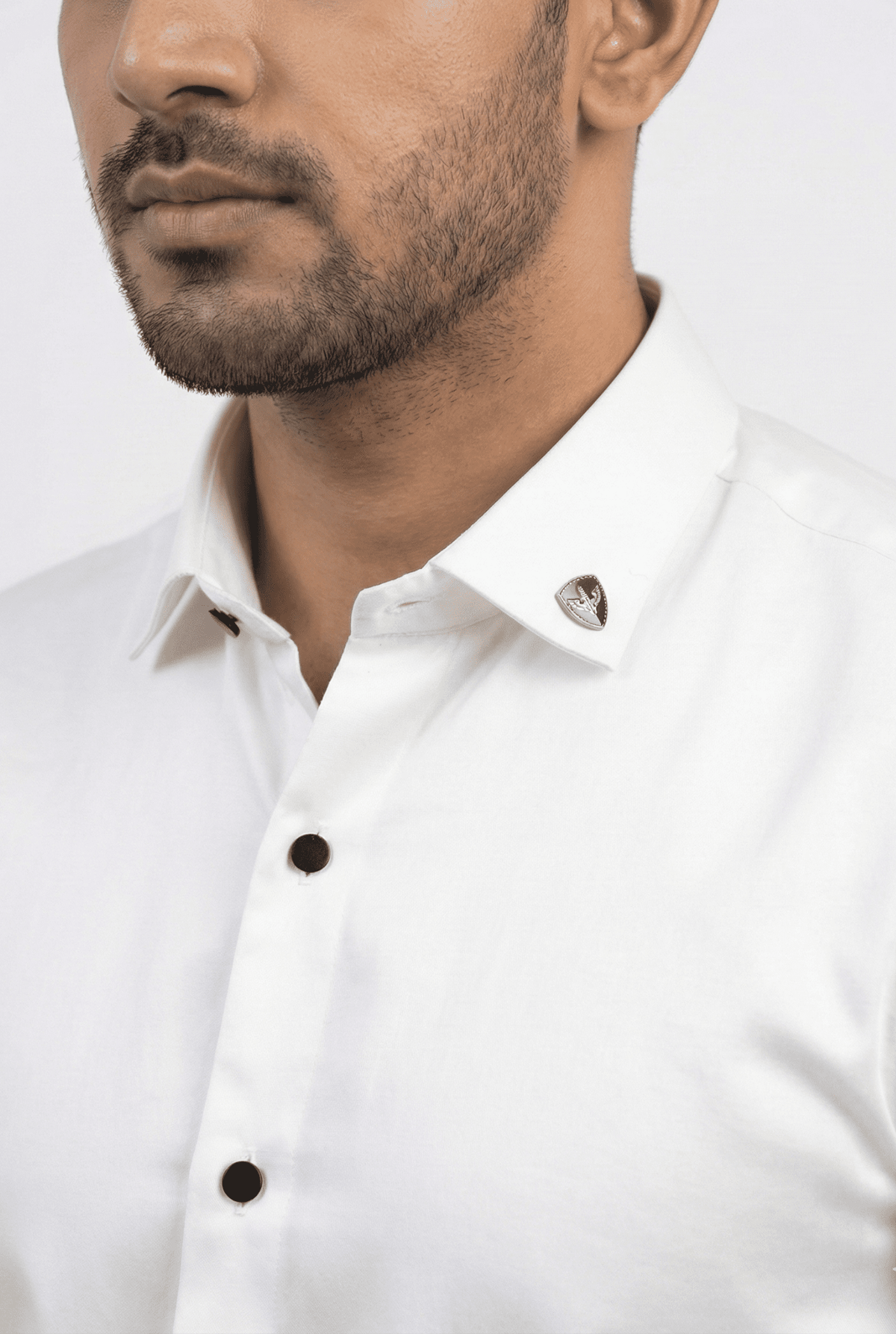 Men's white satin shirt close-up with button placket and fold-over collar